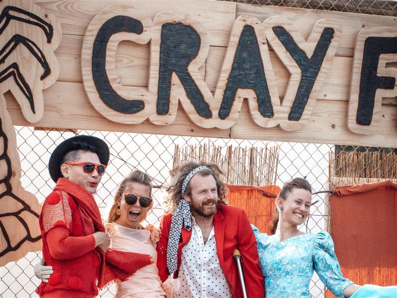People posing under the Cray Fest sign